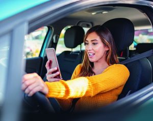 Woman distracted while driving